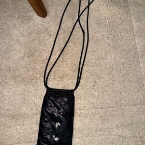 Off White Black Crossbody Bag with Drawstring and Sunglassess